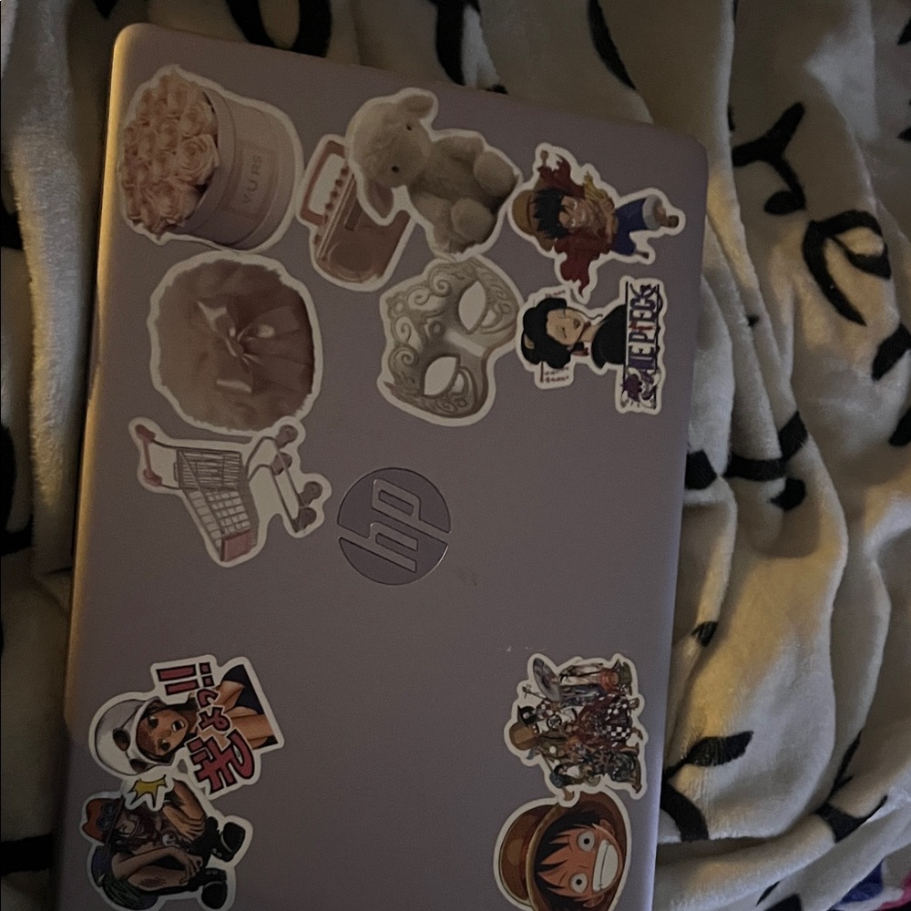 HP Laptop with Anime and Floral Stickers